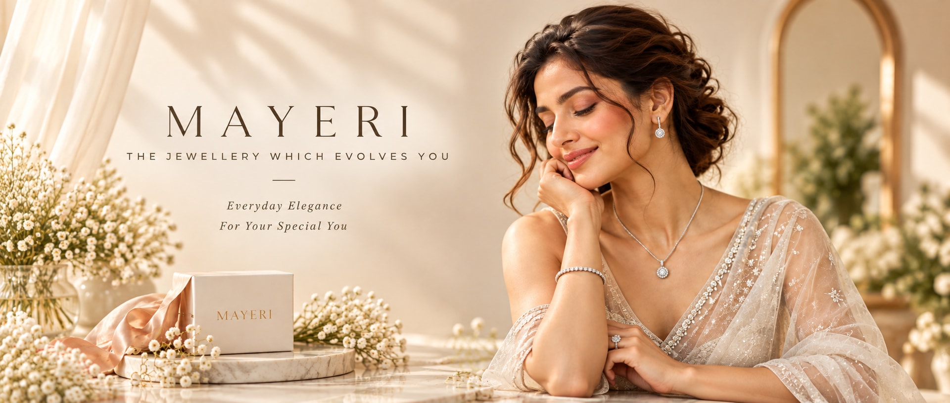 MAYERI — The jewellery which evolves you. Everyday elegance for your special you. Woman in a sheer embroidered drape wearing a MAYERI halo pendant, earrings, bracelet and ring beside a MAYERI gift box